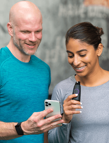 2 smiling people look at Lumen metabolism reviews on Lumen app